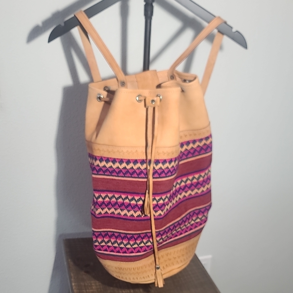 Bohemian-style drawstring backpack is handmade with a combination of hand-woven.
